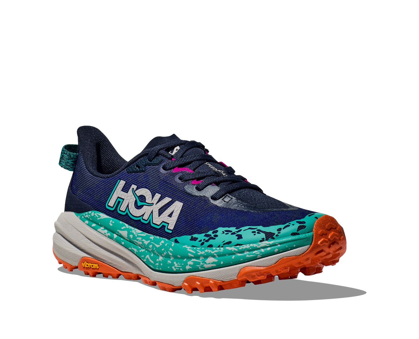 Hoka W Speedgoat 6 Wide - En terräng sko med god dämpning och utmärkt grep. Blå, grå och grön färg med detaljer i rosa och orange.