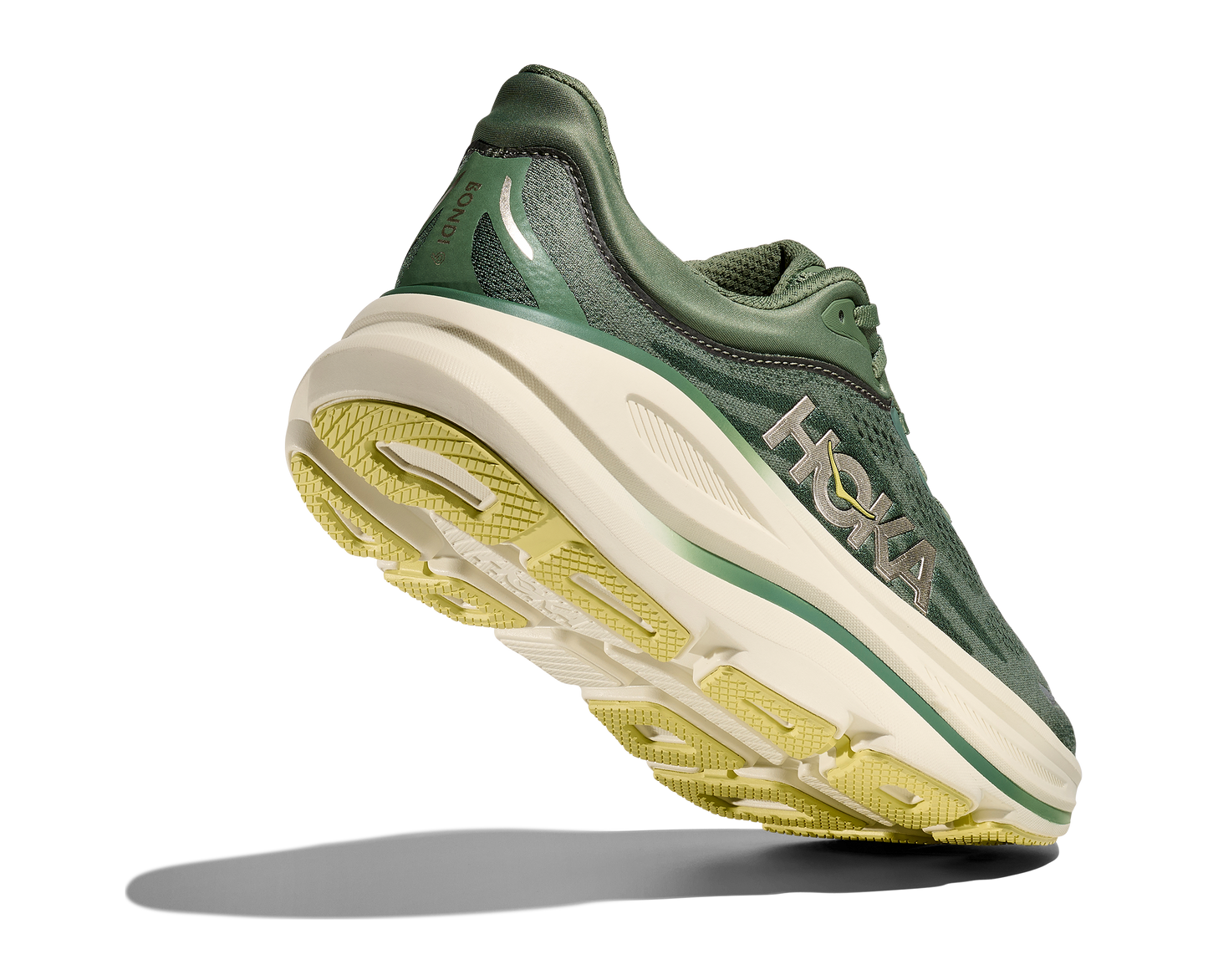 Hoka M Bondi 9, dämpad herrsko. Perfekt för en mjuk och skonsam löpning. Även en super bra arbetssko som avlastar kroppen under hela dagen. Här i grön nyans med beige sula och gula detaljer. Köp hos dina Hoka specialister i Sverige idag!