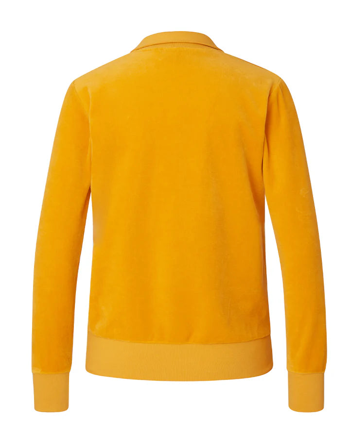Sportig, senapsgul långärmad pikétröja i mjuk och stretchig velour. Etikett på höger sida.