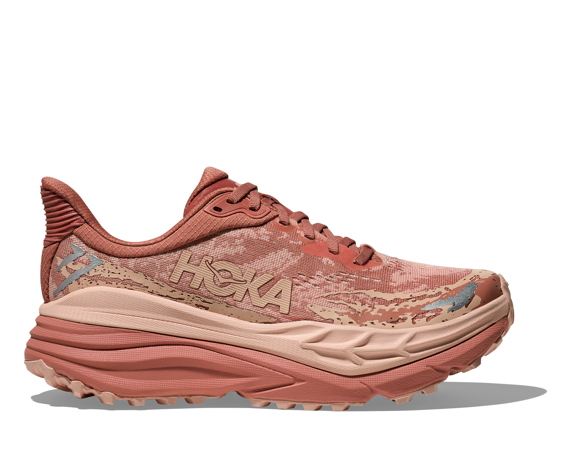Hoka Stinson 7 W, dammodell. Hybridsko för alla underlag. En av Hokas stabilaste skor med pronationsstöd. En väldämpad sko som avlastar rygg och knä. Färgen här är rosa och beige. 