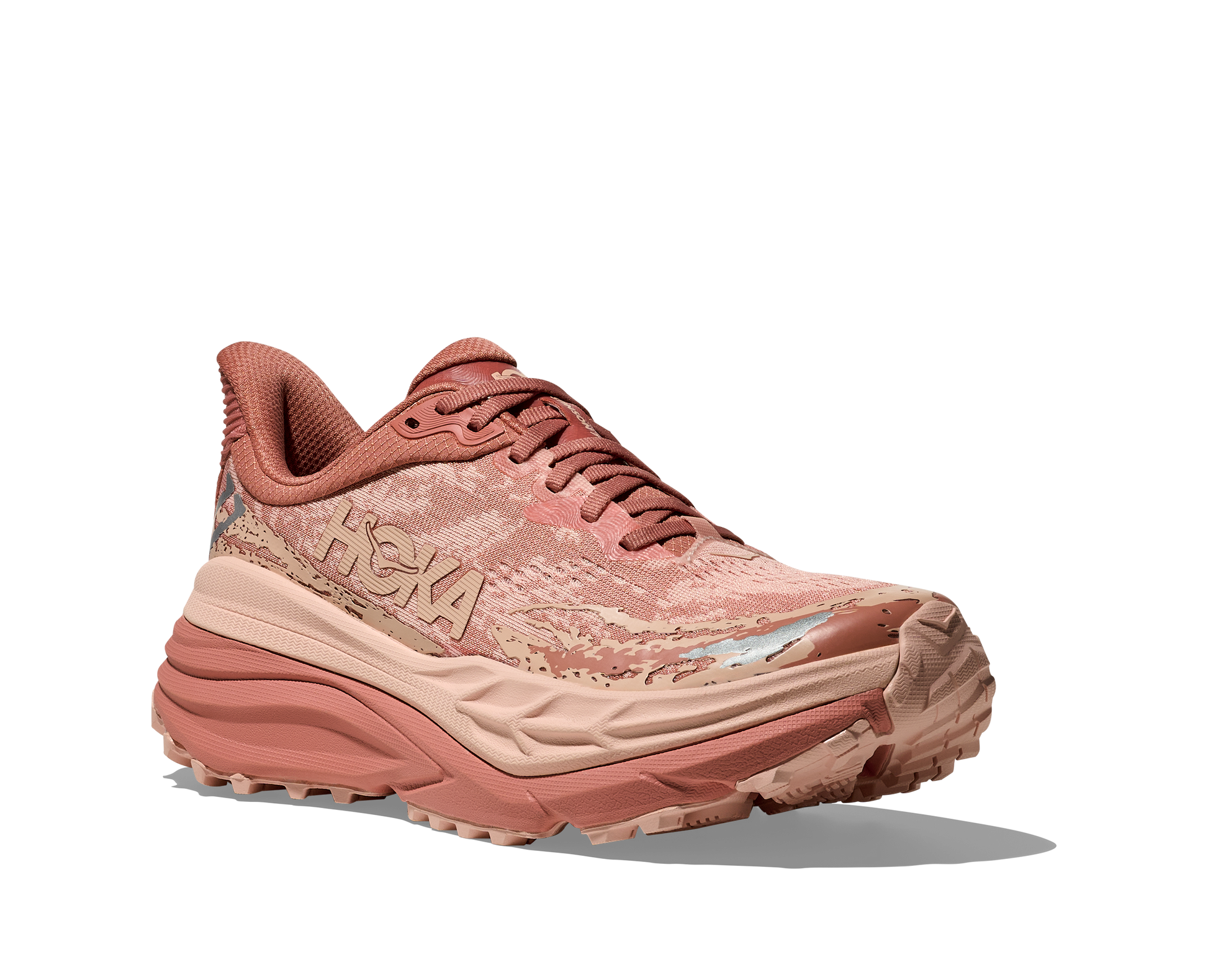 Hoka Stinson 7 W, dammodell. Hybridsko för alla underlag. En av Hokas stabilaste skor med pronationsstöd. En väldämpad sko som avlastar rygg och knä. Färgen här är rosa och beige. 