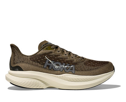 Hoka M Mach 6, superskum med syretillförsel i gummit för att minimera vikt och skapa en så responsiv sko som möjligt. Mach 6 är en snabb löparsko för intervallpass, tävling och löpbandet. Färgen här går i gröna och bruna nyanser med beige sula. Köpt hos oss, din Hoka specialist i Sverige.
