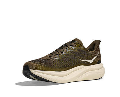 Hoka M Mach 6, superskum med syretillförsel i gummit för att minimera vikt och skapa en så responsiv sko som möjligt. Mach 6 är en snabb löparsko för intervallpass, tävling och löpbandet. Färgen här går i gröna och bruna nyanser med beige sula. Köpt hos oss, din Hoka specialist i Sverige.