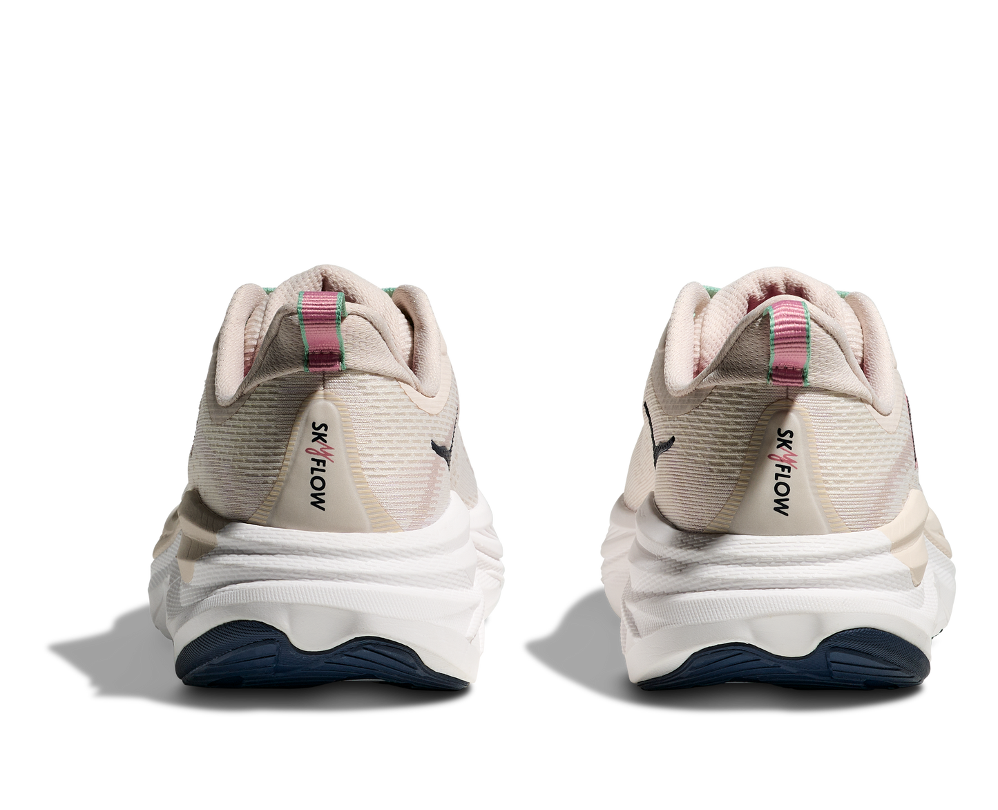 Hoka Skyflow W, löparskor i beige och vit färg med detaljer i rosa, grönt och svart. Dämpad och stabil sko som är gjord för asfalt och grusvägar. Köp hos oss, din Hoka specialist i Sverige!