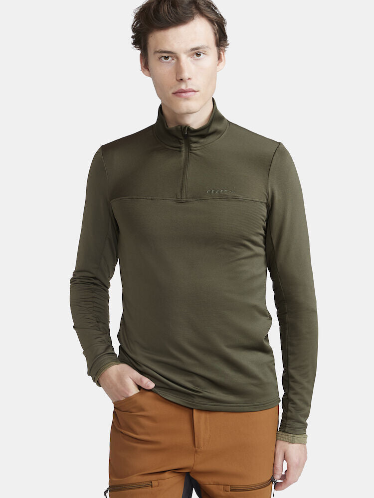 CORE Gain Midlayer. Grön  Långärmad träningströja med tight passform. Dragkedja i hals. Logga på bröstet.