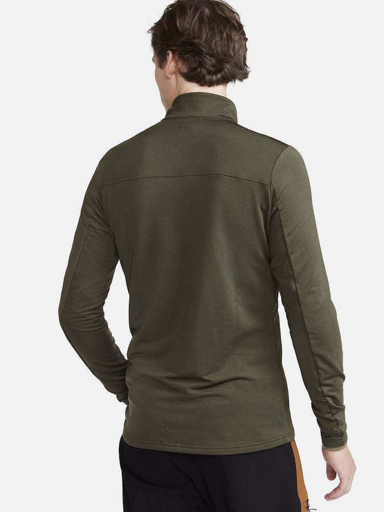 CORE Gain Midlayer. Grön Långärmad träningströja med tight passform. Dragkedja i hals. Logga på bröstet.