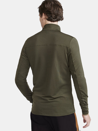 CORE Gain Midlayer. Grön Långärmad träningströja med tight passform. Dragkedja i hals. Logga på bröstet.