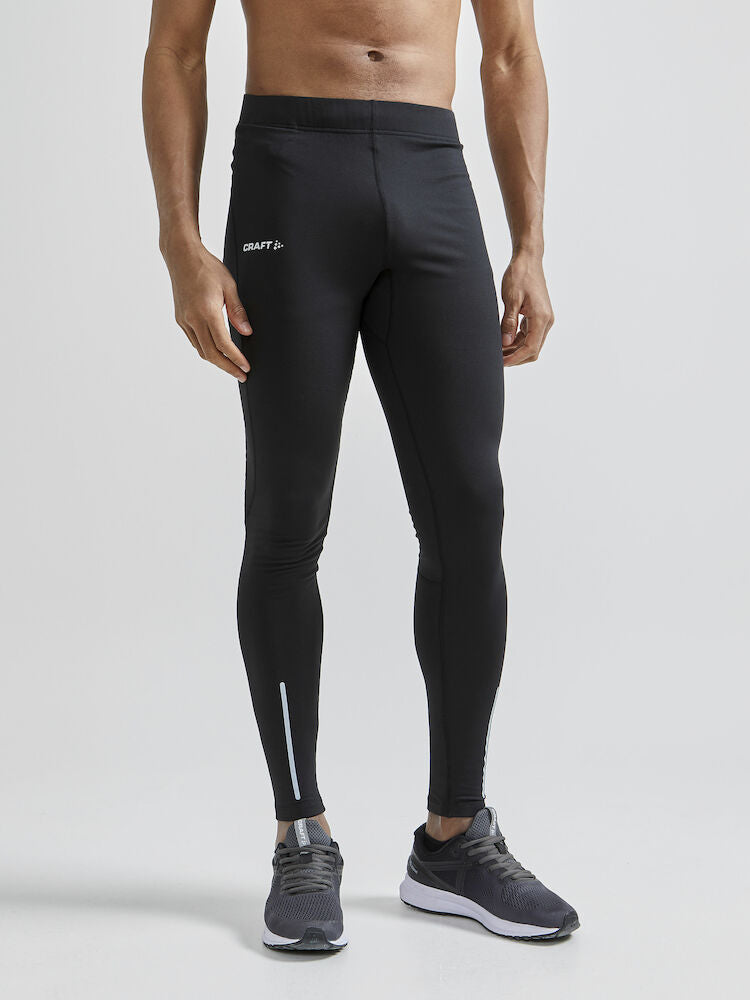 Craft ADV Essence Warm Tights. Svarta tights med elastisk resår i midjan samt dragsko för perfekt passform. Ficka med blixtlås baktill. Reflekterande detaljer samt logga på låret.