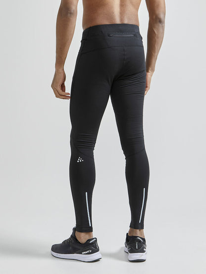 Craft ADV Essence Warm Tights. Svarta tights med elastisk resår i midjan samt dragsko för perfekt passform. Ficka med blixtlås baktill. Reflekterande detaljer samt logga på låret.