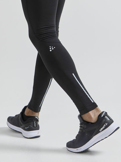 Craft ADV Essence Warm Tights. Svarta tights med elastisk resår i midjan samt dragsko för perfekt passform. Ficka med blixtlås baktill. Reflekterande detaljer samt logga på låret.