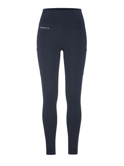 Craft ADV Essence High Waist Warm Tights. Mörkblå tights i dammodell med bred resår i midjan. Två stora ytterfickor på benen samt nyckelficka i midjan. 