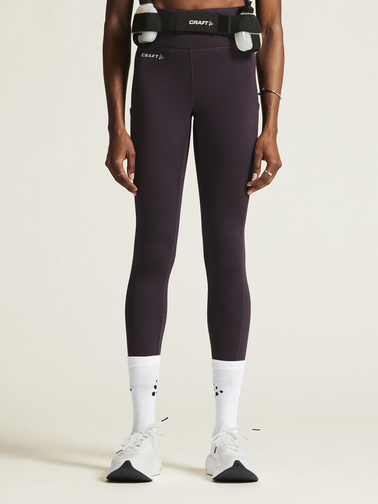 Craft ADV Essence High Waist Warm Tights. Lila tights i dammodell med bred resår i midjan. Två stora ytterfickor på benen samt nyckelficka i midjan. 