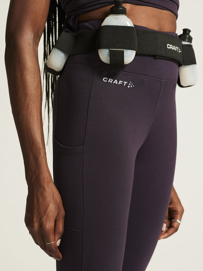 Craft ADV Essence High Waist Warm Tights. Lila tights i dammodell med bred resår i midjan. Två stora ytterfickor på benen samt nyckelficka i midjan. 