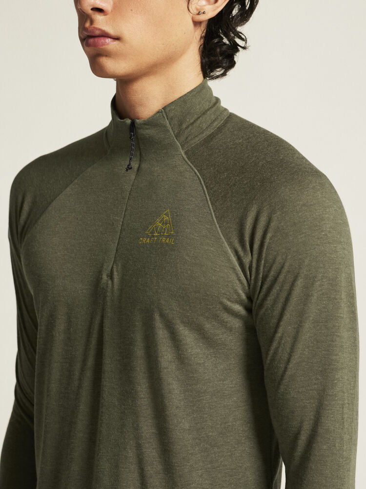 ADV SubZ Wool LS Tee 3 Grön  Långärmad polotröja med dragkedja i halsen. Merinoull-blandning för värme och komfort. Hål för tumme ärmslut. Reflekterande detaljer. Ventilerande mesh-panel i rygg. 