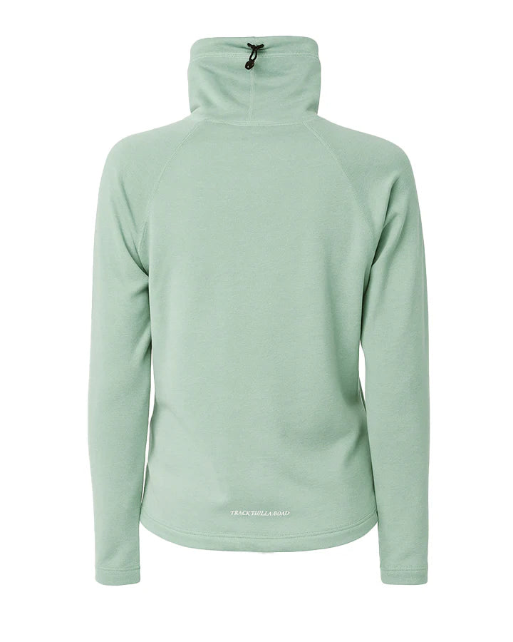 YMR Åsunden Ladies Funnel Neck Mint. Ljusgrön mångsidig och mjuk tröja med mörkblått inuti den höga kragen och på logotyp på bröstet. Dragsko i både kragen och i midjan för justerbar passform. Reflexdetalj på nedre delen av ryggen. 