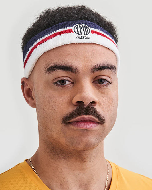 YMR Bäckaryd Headband. Pannband av frotté i vitt, rött och blått. Logotyp i mörkblått framtill. 